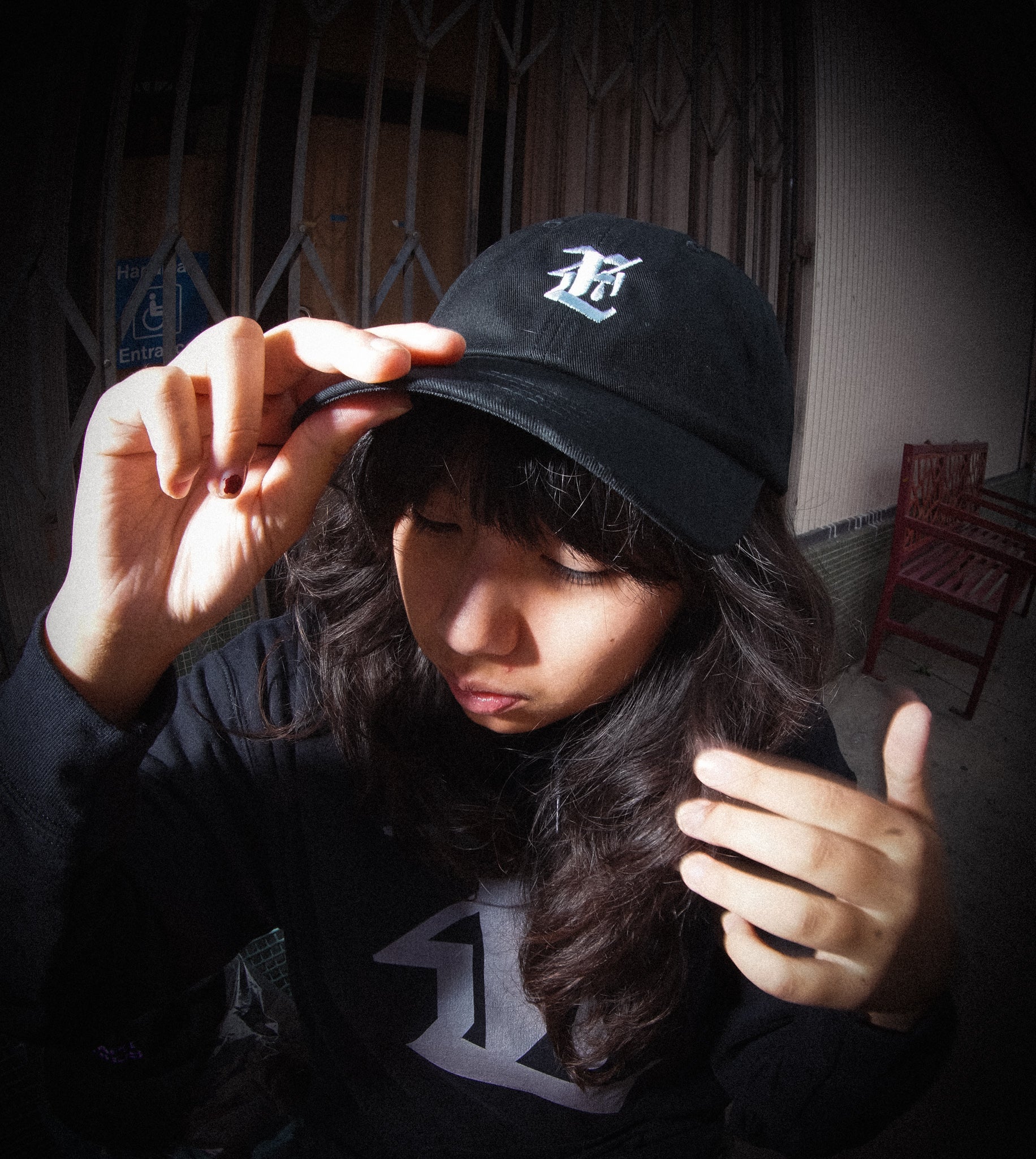 Model wearing Teardrop Emblem Hat (Black)