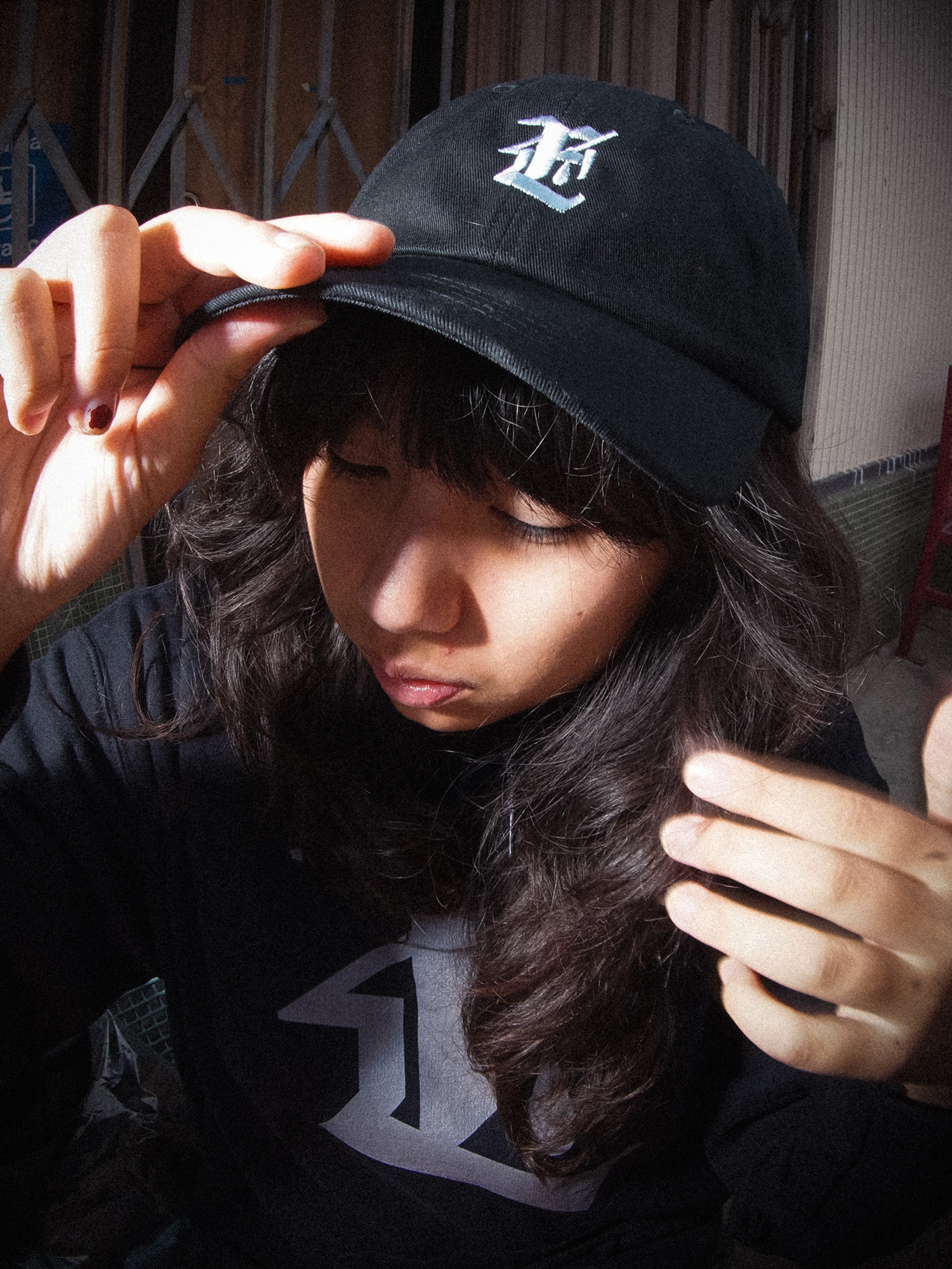 Model wearing Teardrop Emblem Hat (Black)