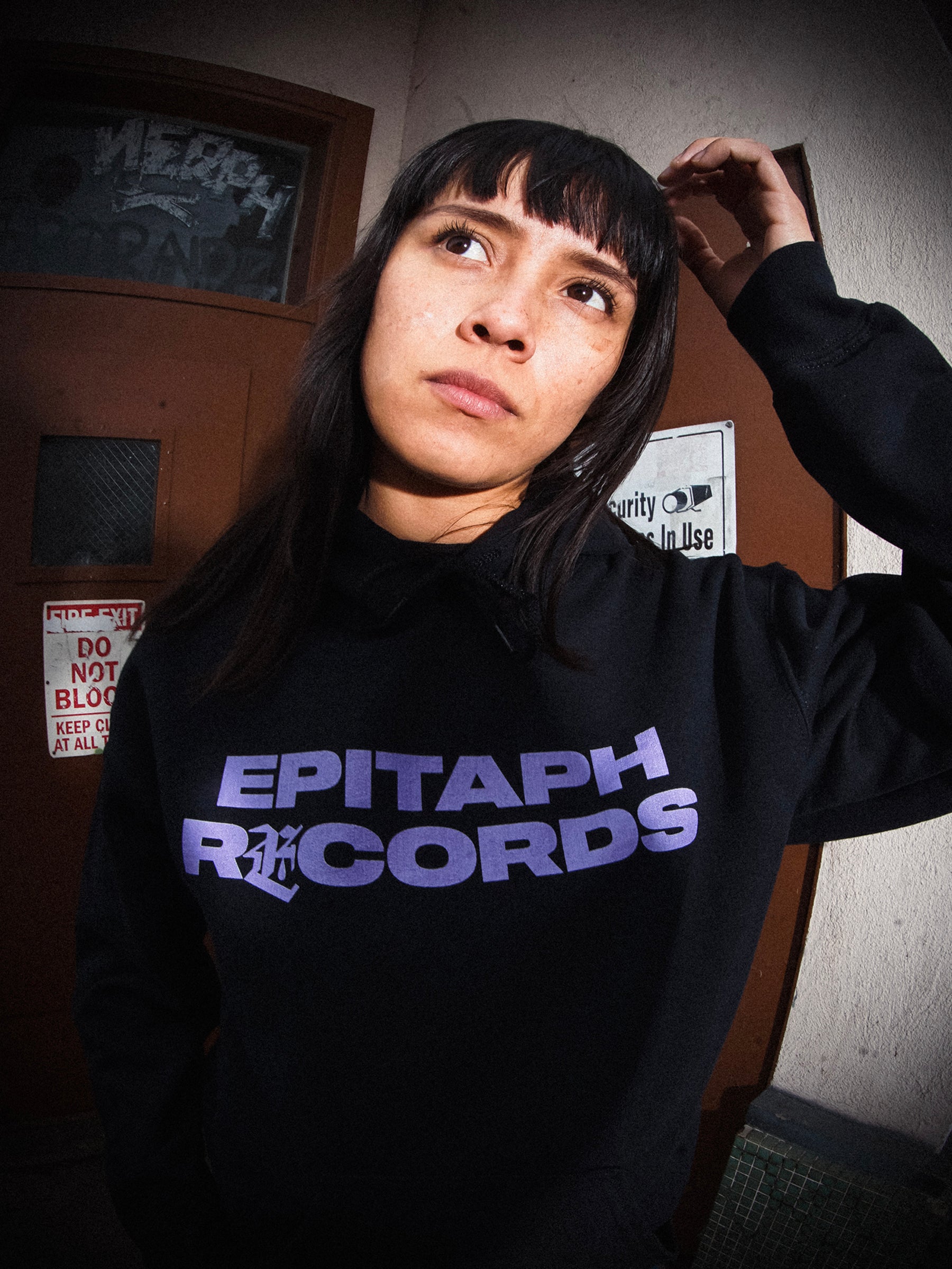 Model wearing Epitaph Records Logo Hoodie (Black)